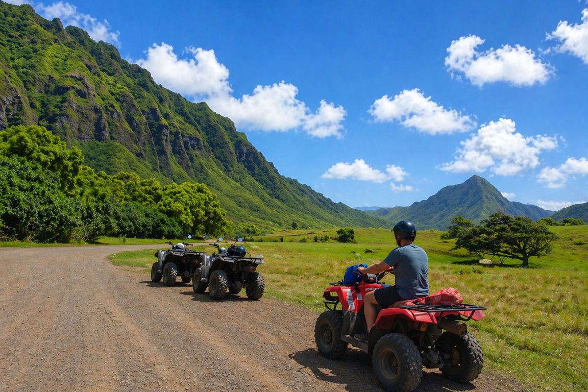 Kualoa Ranch ATV adventure featuring rugged trails, green fields, and dramatic mountain backdrop during a tour with our agency